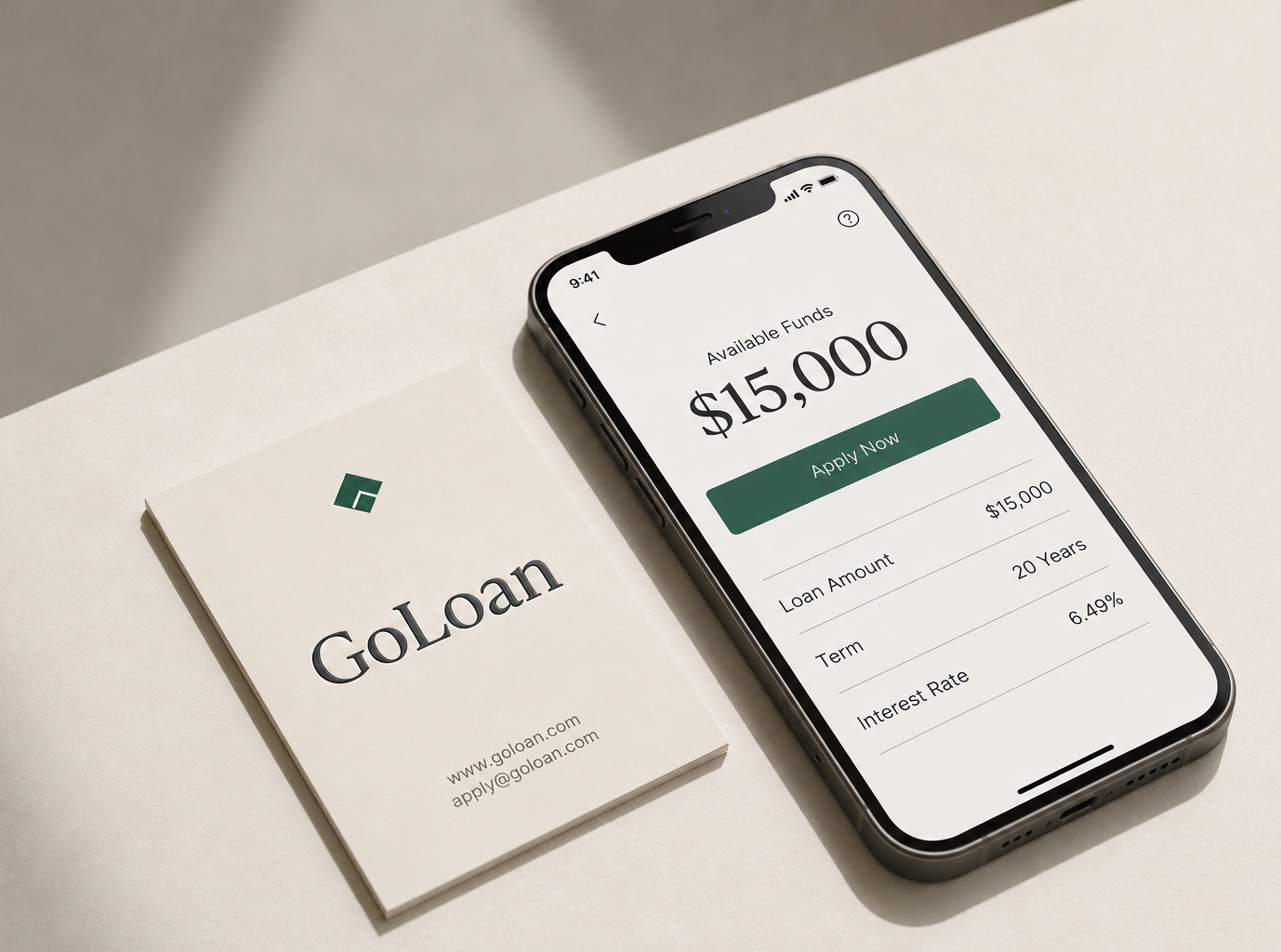 GoLoan brand mockup: a letterpress business card beside a phone showing the GoLoan loan app